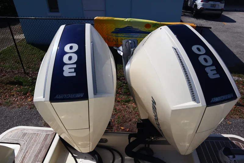 Slide: The Image of Twin Mercury 300 outboard engines on a 2020 Chris-Craft Calypso 30 boat. - 32