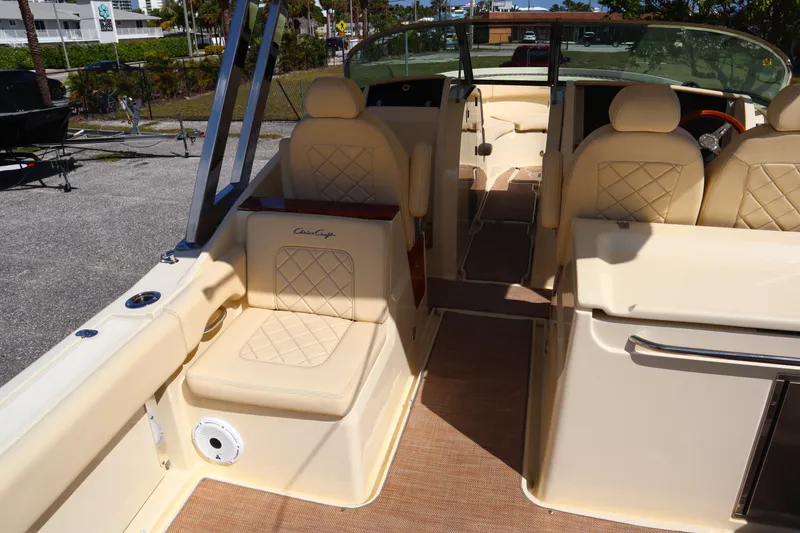 Slide: The Image of 2020 Chris-Craft Calypso 30 interior with beige seating and elegant design. - 33