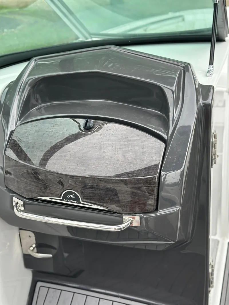 Slide: The Image of 2017 Monterey M6 boat dashboard with sleek design and chrome accents. - 25