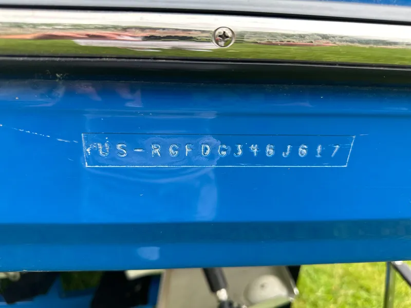 Slide: The Image of VIN on blue 2017 Monterey M6 boat, close-up view. - 4