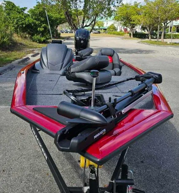 Slide: The Image of 2025 Tracker Pro Team 175 boat with red trim and advanced fishing equipment. - 2