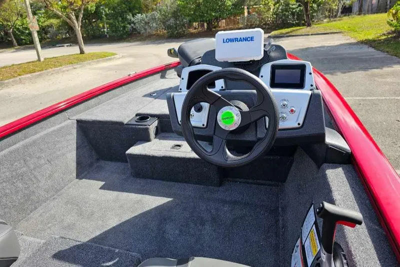 Slide: The Image of 2025 Tracker Pro Team 175 boat interior with steering wheel and Lowrance electronics. - 5