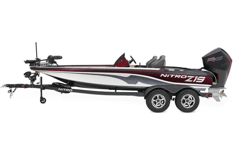 Slide: The Image of 2025 Nitro Z19 Pro boat on trailer, parked outdoors, featuring sleek design and powerful engine. - 3