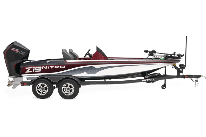 Slide: The Image of 2025 Nitro Z19 Pro boat on trailer, parked outdoors, side view. - 4
