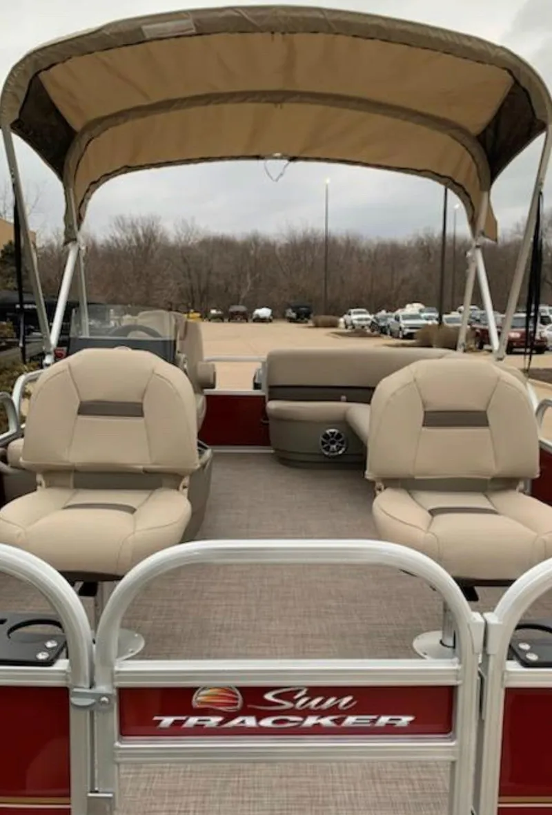 Slide: The Image of 2025 Sun Tracker Bass Buggy 18 DLX pontoon boat with canopy and seating. - 2
