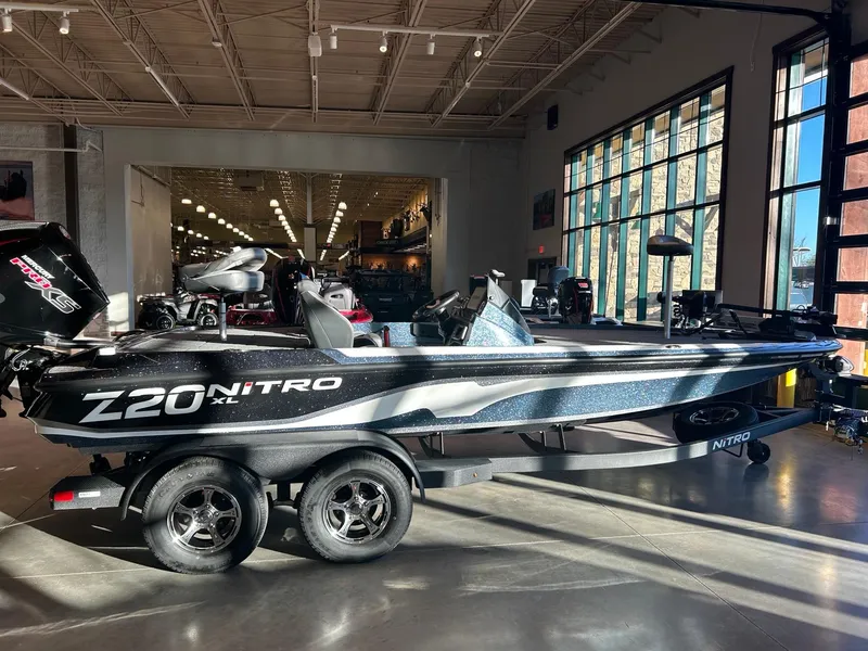 The Image of 2025 Nitro Z20 XL Pro boat on trailer outside service center. - 0