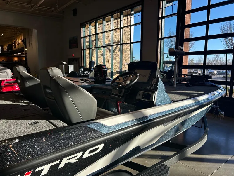 Slide: The Image of 2025 Nitro Z20 XL Pro boat interior with dual seats and sleek design. - 2