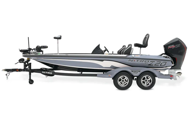 Slide: The Image of 2025 Nitro Z20 XL Pro boat on trailer, parked outdoors, showcasing sleek design and powerful engine. - 5