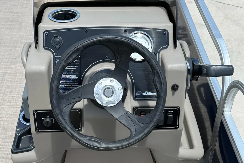 Slide: The Image of Steering console of 2025 Sun Tracker Bass Buggy 16 XL Select pontoon boat. - 4