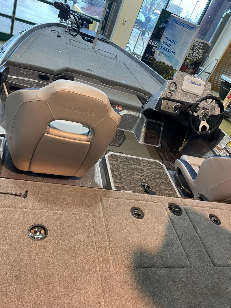 Slide: The Image of 2025 Nitro Z21 XL boat interior with modern seating and dashboard design. - 3
