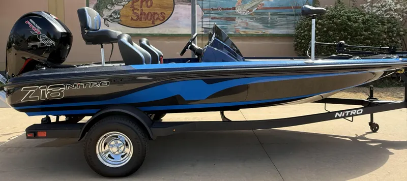 Slide: The Image of 2025 Nitro Z18 boat with sleek design and powerful engine on display. - 3