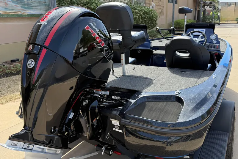 Slide: The Image of 2025 Nitro Z18 boat with powerful outboard motor, sleek design, and spacious seating. - 4