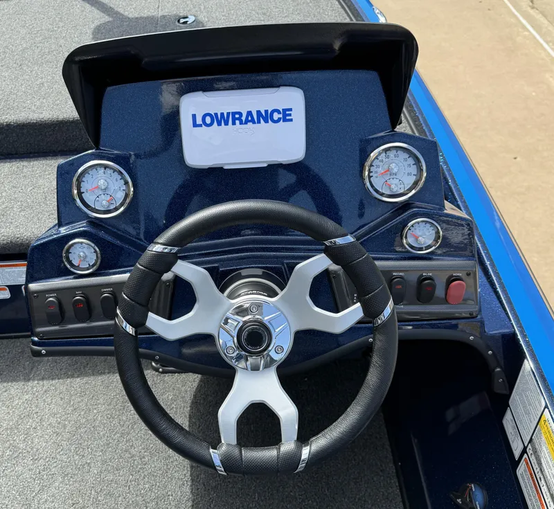 Slide: The Image of 2025 Nitro Z18 boat dashboard with Lowrance display and steering wheel. - 6