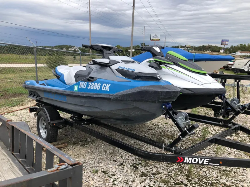 The Image of 2019 Sea-Doo GTX 155 jet ski on trailer, parked outdoors. - 1