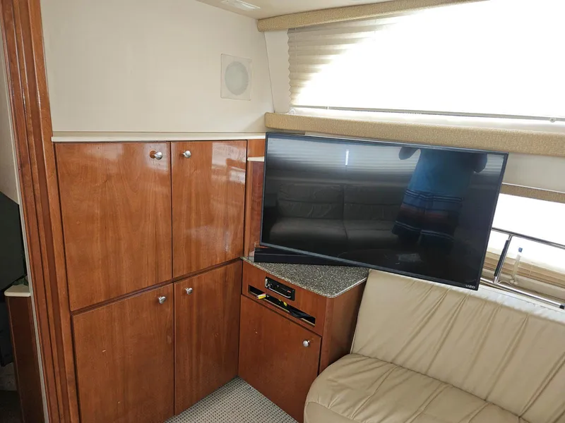 Slide: The Image of Interior of 2005 Meridian 368 Motoryacht with TV and wooden cabinets. - 16