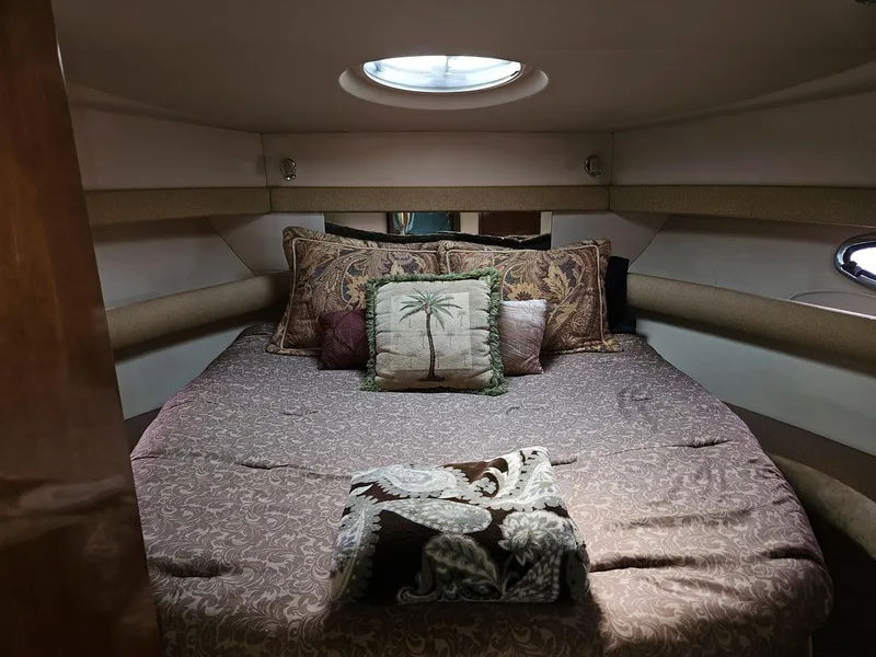 Slide: The Image of 2005 Meridian 368 Motoryacht bedroom with cozy bedding and decorative pillows. - 18