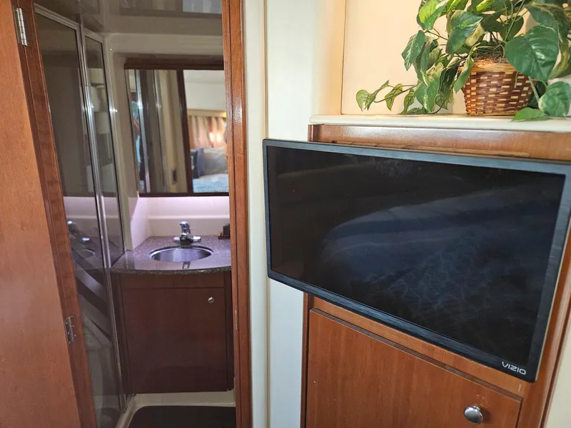 Slide: The Image of Interior of 2005 Meridian 368 Motoryacht with TV, sink, and potted plant. - 22