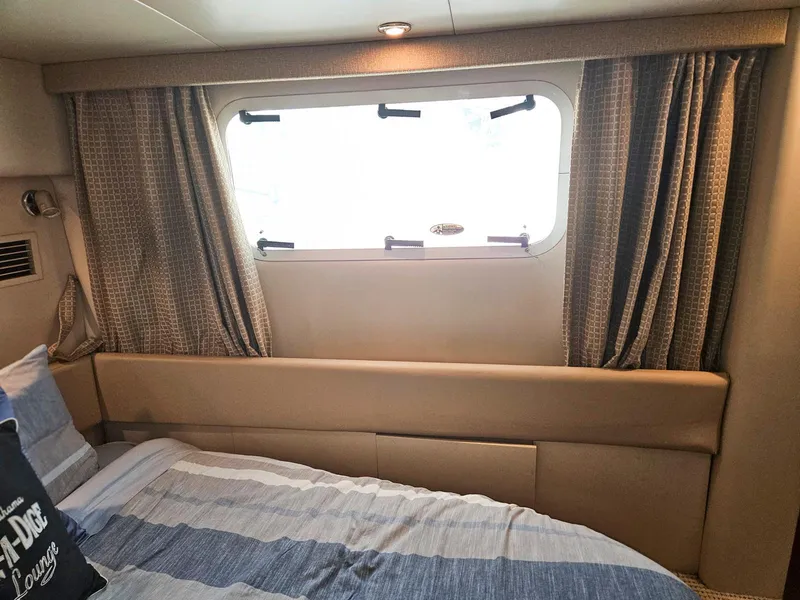 Slide: The Image of Interior cabin of 2005 Meridian 368 Motoryacht with bed and window. - 23