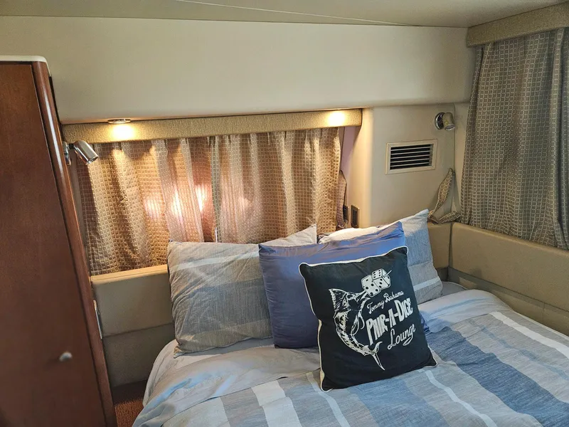 Slide: The Image of Cozy bedroom in 2005 Meridian 368 Motoryacht with nautical-themed decor. - 24