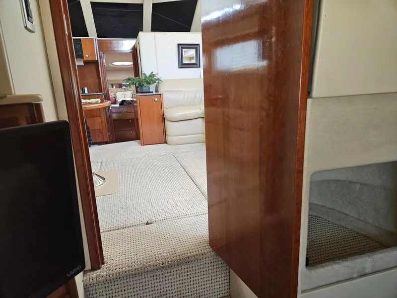 Slide: The Image of Interior of 2005 Meridian 368 Motoryacht with wood paneling and beige seating. - 25