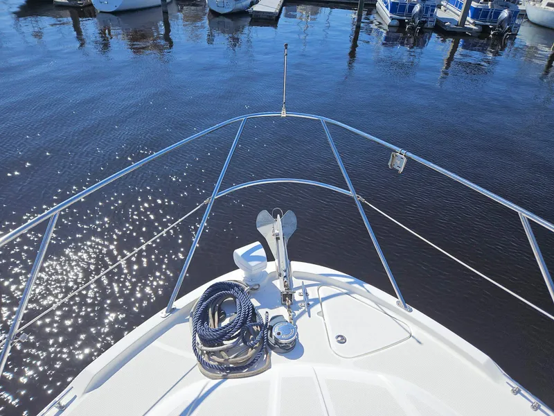 Slide: The Image of Bow view of 2005 Meridian 368 Motoryacht with anchor and rope, docked in marina. - 5