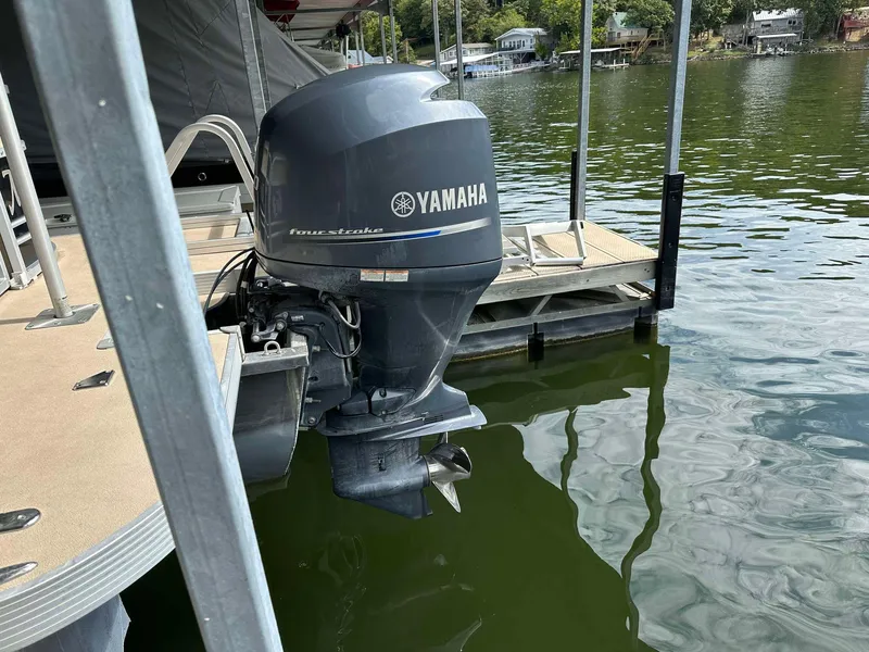 Slide: The Image of Yamaha outboard motor on 2013 G3 SunCatcher V322 RC pontoon boat at dock. - 10