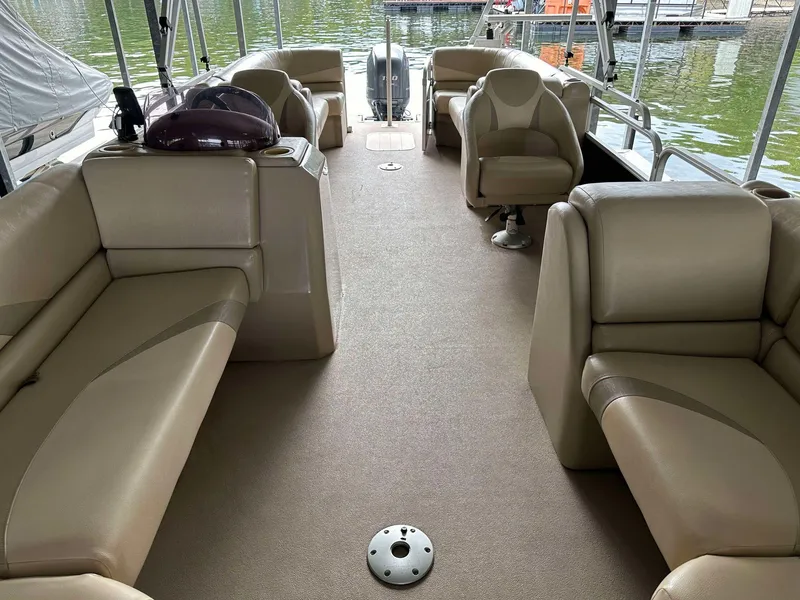 Slide: The Image of 2013 G3 SunCatcher V322 RC pontoon boat interior with beige seating and lake view. - 14