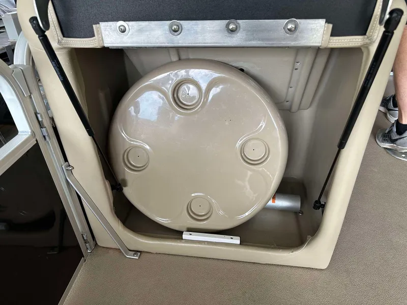 Slide: The Image of 2013 G3 SunCatcher V322 RC storage compartment with beige circular cover. - 23