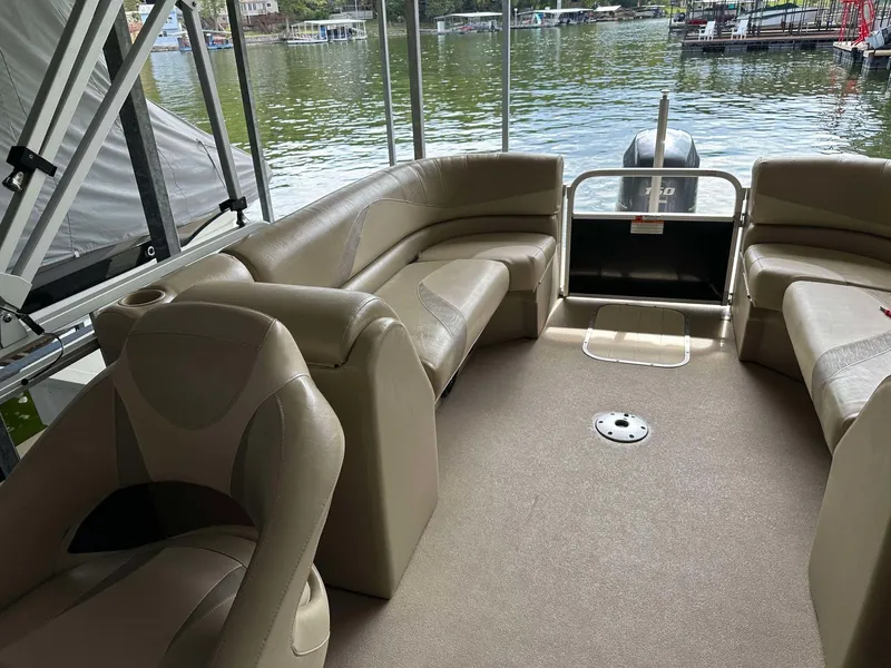 Slide: The Image of 2013 G3 SunCatcher V322 RC pontoon boat interior with beige seating and lake view. - 25