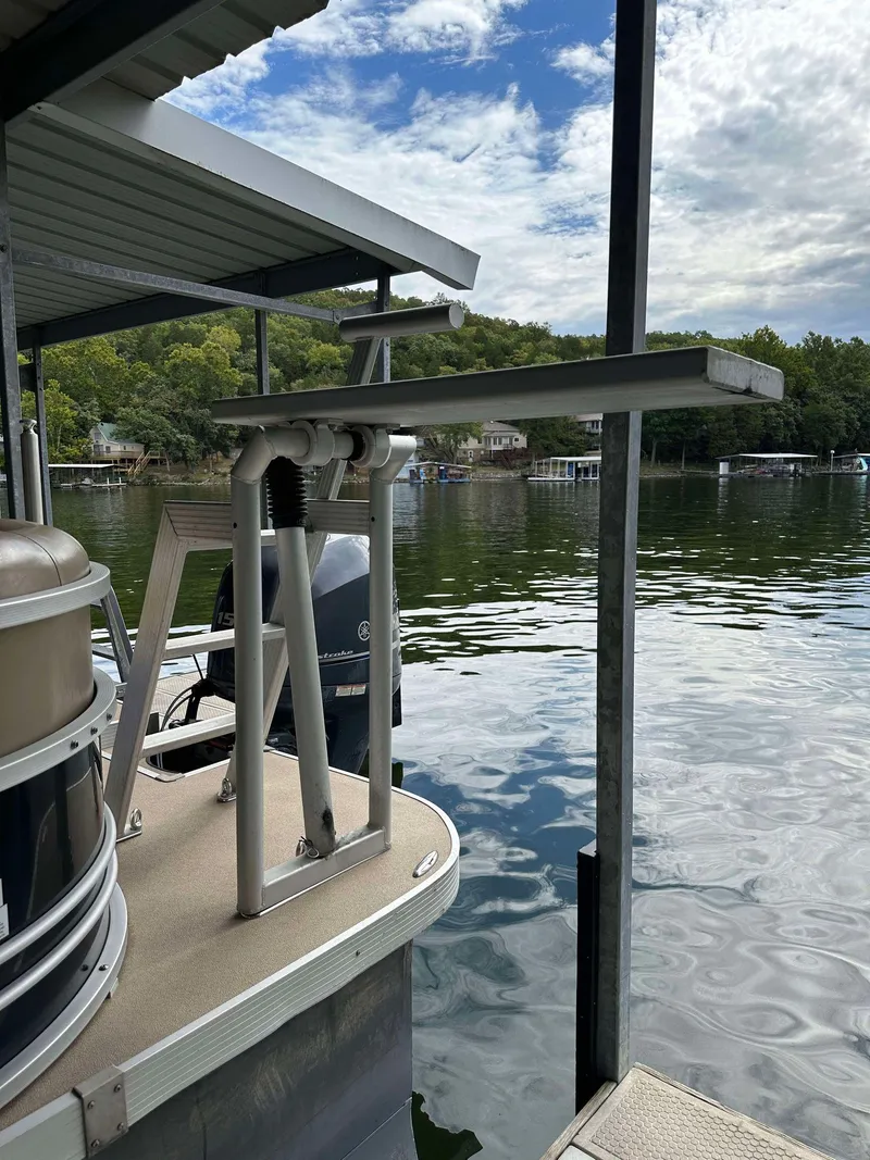 Slide: The Image of 2013 G3 SunCatcher V322 RC pontoon boat docked on a serene lake. - 27