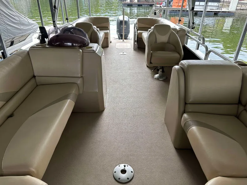 Slide: The Image of 2013 G3 SunCatcher V322 RC pontoon boat interior with beige seating and spacious layout. - 6