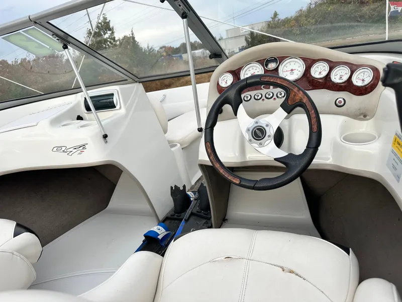 Slide: The Image of 2013 Tahoe Q4i boat interior with steering wheel and dashboard gauges. - 7
