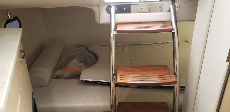 Slide: The Image of Helm of 2025 Regal 26 XO boat with modern navigation system and controls. - 13