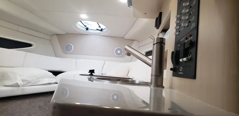 Slide: The Image of 2025 Regal 26 XO boat cockpit with modern steering and plush seating. - 15