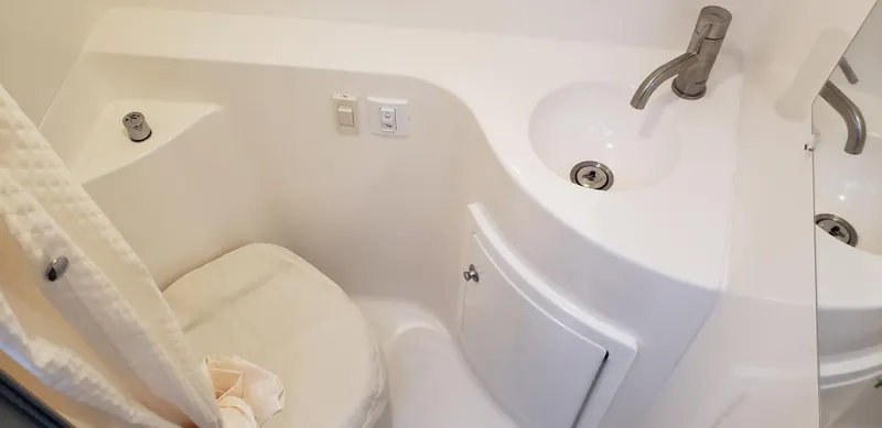 Slide: The Image of Compact bathroom in 2025 Regal 26 XO boat with sink and toilet. - 33