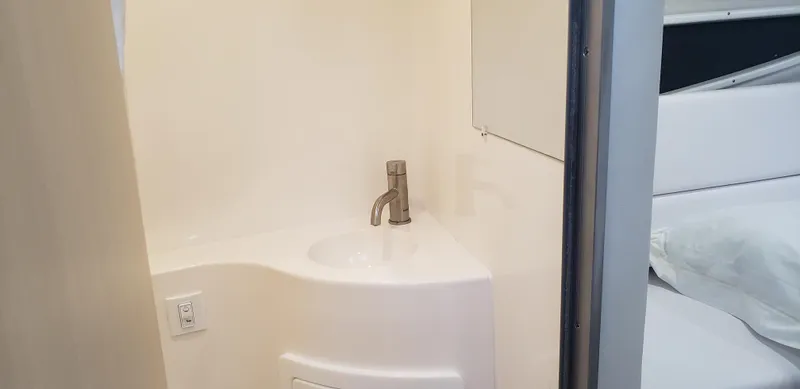 Slide: The Image of 2025 Regal 26 XO boat interior with compact sink and faucet. - 34