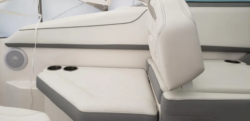 Slide: The Image of 2025 Regal 26 XO boat interior with luxurious white seating and elegant design. - 6