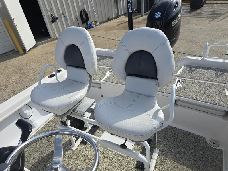 Slide: The Image of 2019 Blue Wave 2200 PureBay boat interior with dual white cushioned seats. - 15