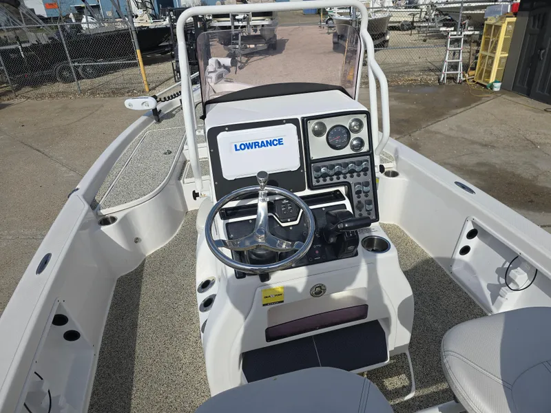 Slide: The Image of 2019 Blue Wave 2200 PureBay boat console with steering wheel and Lowrance electronics. - 16