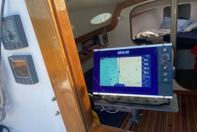Slide: The Image of Navigation equipment inside a 2003 Alerion Express 28 sailboat cabin. - 31