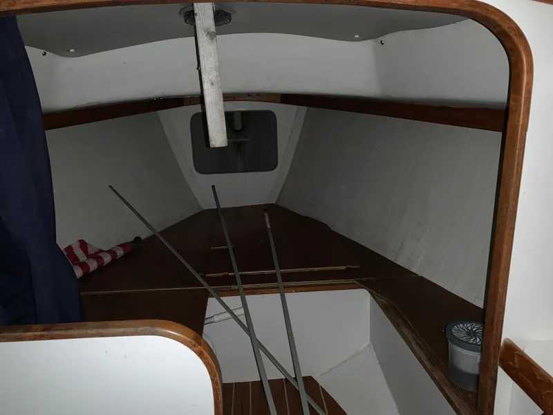 Slide: The Image of Interior cabin of 2003 Alerion Express 28 sailboat, featuring wooden trim and cozy layout. - 41