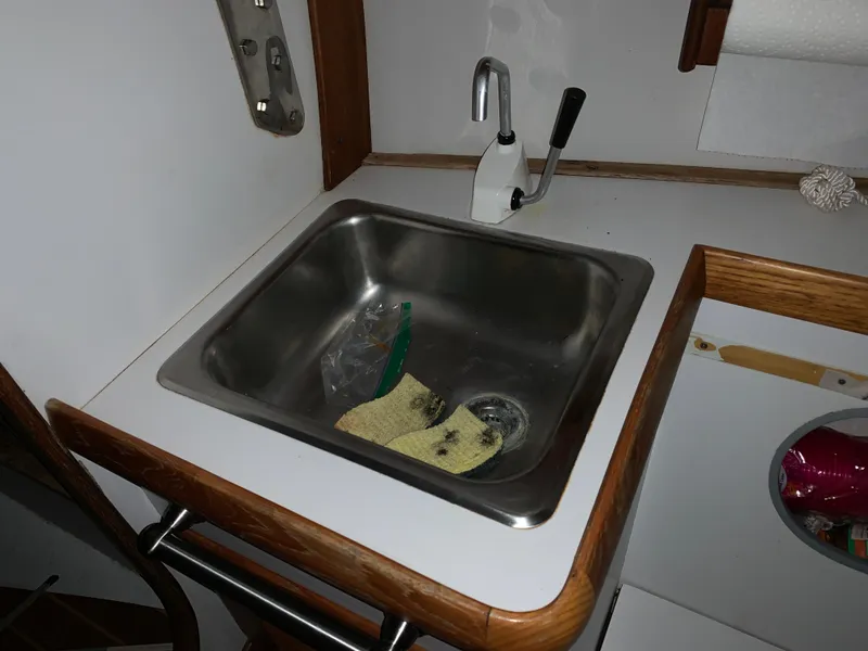 Slide: The Image of Small kitchen sink in 2003 Alerion Express 28 sailboat galley. - 42