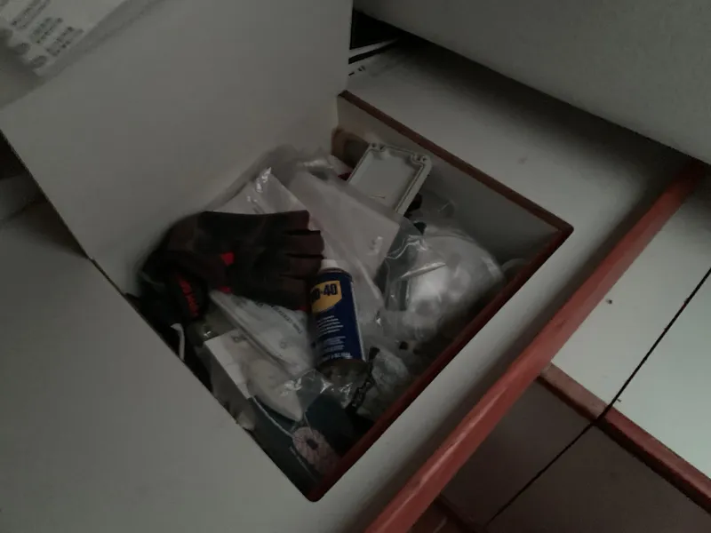 Slide: The Image of Storage compartment with tools and supplies on a 2003 Alerion Express 28 sailboat. - 43