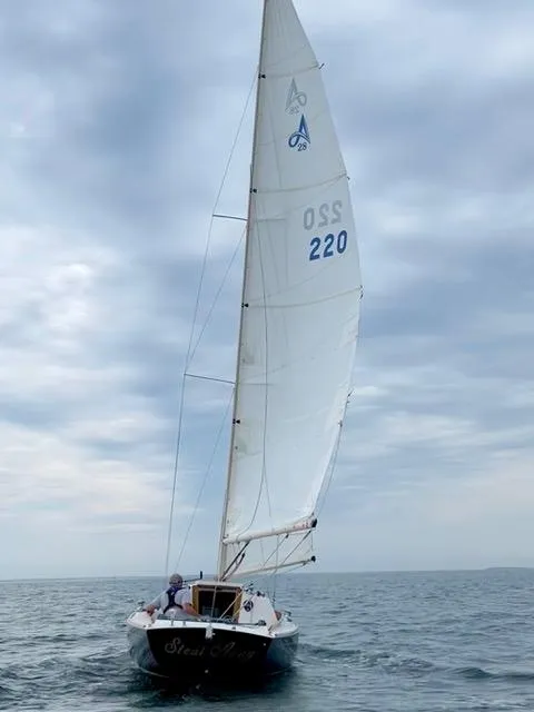 Slide: The Image of Sailboat Alerion Express 28, 2003 model, sailing on a cloudy day. - 8