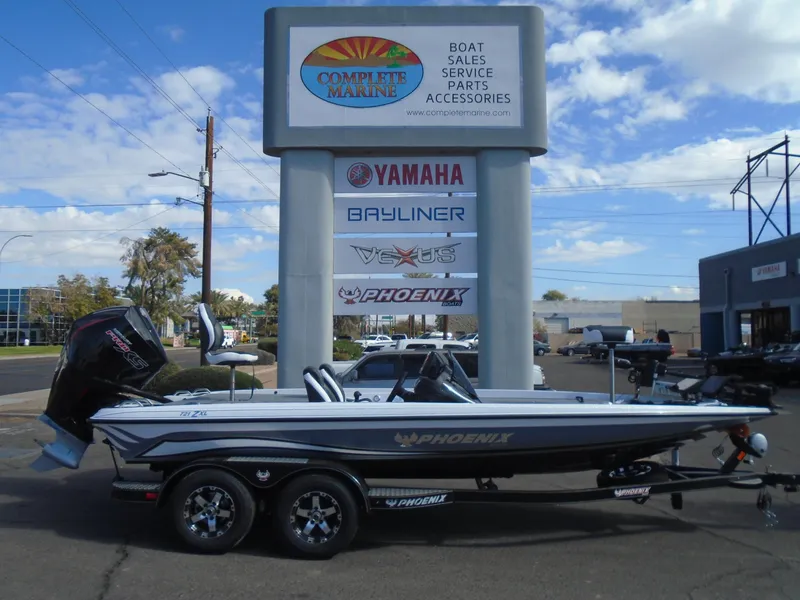 Slide: The Image of 2025 Phoenix 721 ZXL boat displayed at Complete Marine dealership. - 19