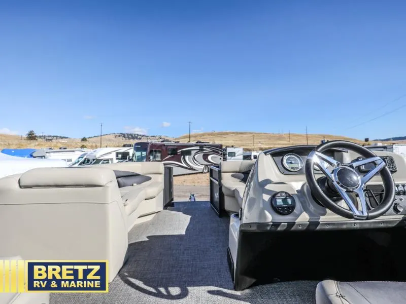 Slide: The Image of Interior view of 2023 Aria 22UC boat with steering wheel and seating, Bretz RV & Marine. - 12