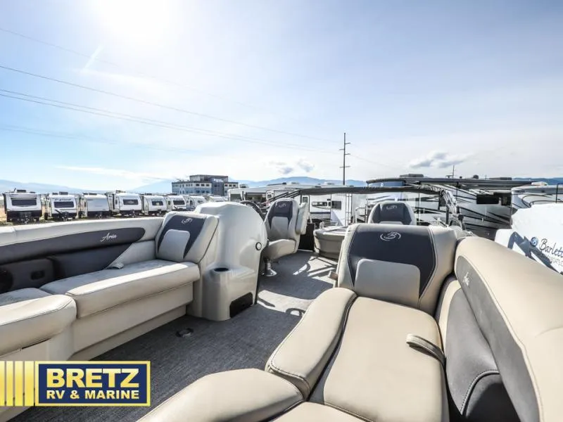 Slide: The Image of 2023 Aria 22UC boat interior with plush seating at Bretz RV & Marine dealership. - 15