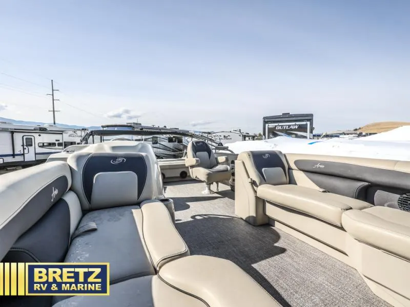 Slide: The Image of 2023 Aria 22UC boat interior with beige seating at Bretz RV & Marine dealership. - 9