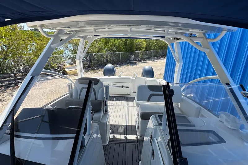 Slide: The Image of 2020 World Cat 28 DCX boat interior with seating and dual engines. - 10