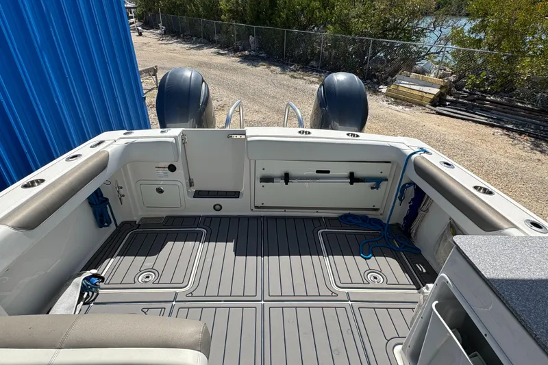 Slide: The Image of 2020 World Cat 28 DCX boat deck with dual engines and spacious seating area. - 4